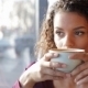 Girl With a Wonderful Smile Drinking Coffee - VideoHive Item for Sale