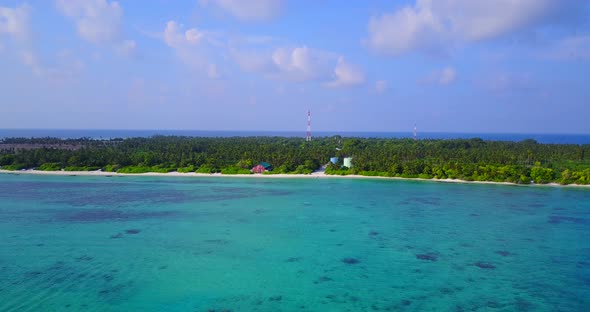 Beautiful flying island view of a white sandy paradise beach and aqua blue water background in hi re alt