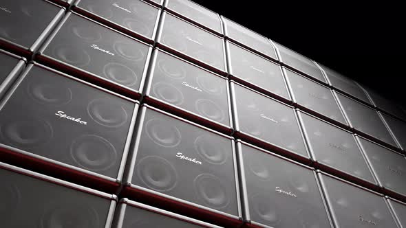 Playing cabinet speakers stacked on a stage in form of an endless wall pattern. alt