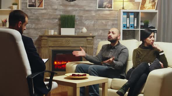 Woman Sitting on Couch Crying at Couple Therapy alt