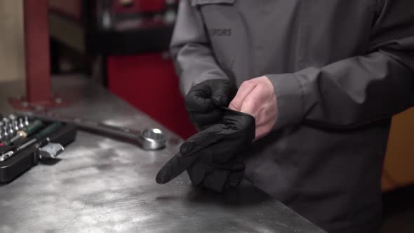 Man Wears Black Leather Gloves