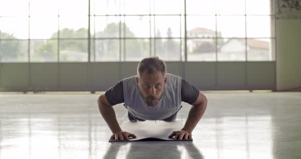Young Adult Man Doing Push Ups Exercise During Fitness Sport Workout
