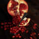 Pomegranate Clusters Falling On Wooden Table - VideoHive Item for Sale