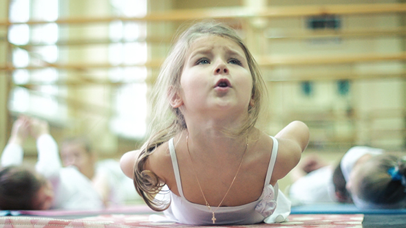 Little Girl Doing Gymnastics Exercises In Dance Class