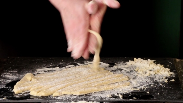 Female Hands Making Pasta Pici