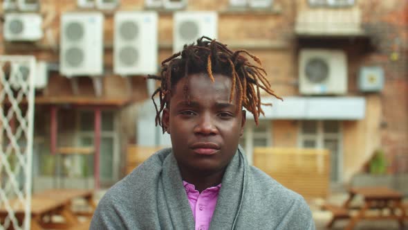 Slow Motion, Man Stand on the Street and Look at the Camera alt