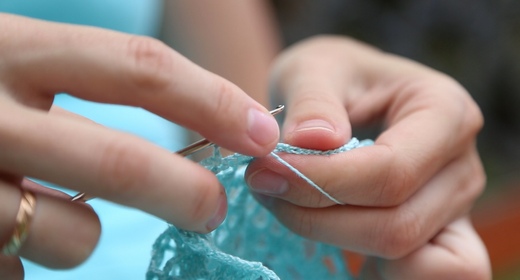 Woman Knits via Needle