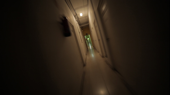 Running Away From the Darkness Through a Creepy Corridor