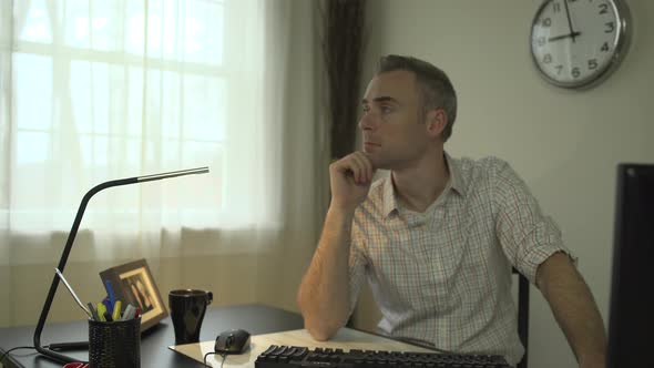 Overwhelmed Man At His Office Desk alt