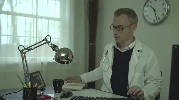 Doctor Working At His Office Desk 13 alt
