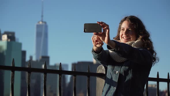 A Beautiful Woman Taking Selfies, Nyc Skyline In Background 3 alt