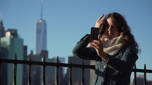 A Beautiful Woman Taking Selfies, Nyc Skyline In Background 4 alt