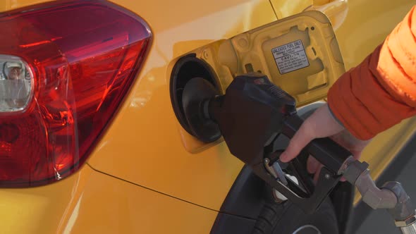 Taxi Cab Refueling At A Gas Station alt