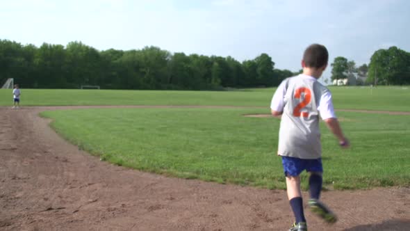 Children Playing Kickball In A Park 2 alt