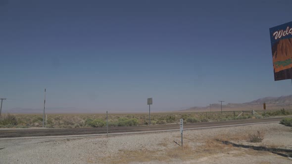 Welcome To Utah Sign Along Side Of Road alt