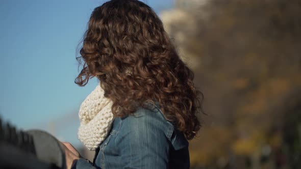 Woman Leans Back, Smiling alt