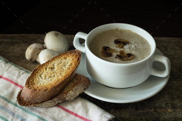 Creamy mushroom soup with slice of bread