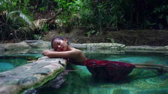 Cute Asian Girl Relaxing in Hot Spring Thailand