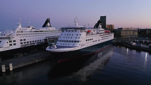 Industrial Architecture and Drone Shot of White Nordhavn Cruise Ship in Port alt
