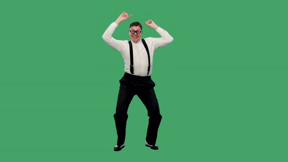 A Positive Man in a White Shirt with Suspenders and Glasses with Thick Lenses is Having Fun Dancing alt