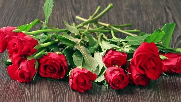 Valentines Day's Arrangements With Red Roses And Heart Over Gray Background