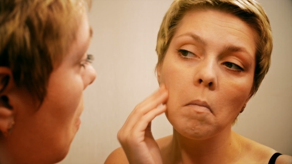 Woman Applies Make-up Concealer Foundation Cream