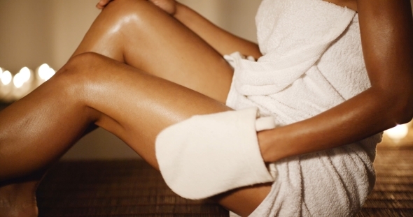 Woman Massaging His Leg With Glove alt