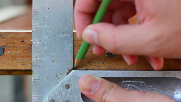 Carpenter Measuring Wooden Detail With Ruler