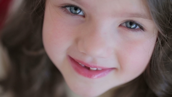 Little Girl Smiling Looking  Camera