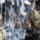 Statuettes With The Buddhas Under a Waterfall - VideoHive Item for Sale