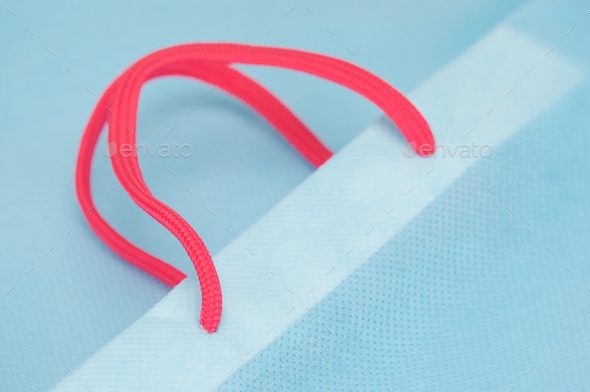 Close up pink rope with light blue bag