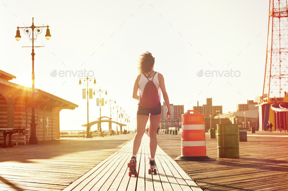 Woman skating on road - Stock Photo - Images