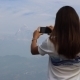 Woman Takes a Picture Of The Mountains On a Mobile - VideoHive Item for Sale