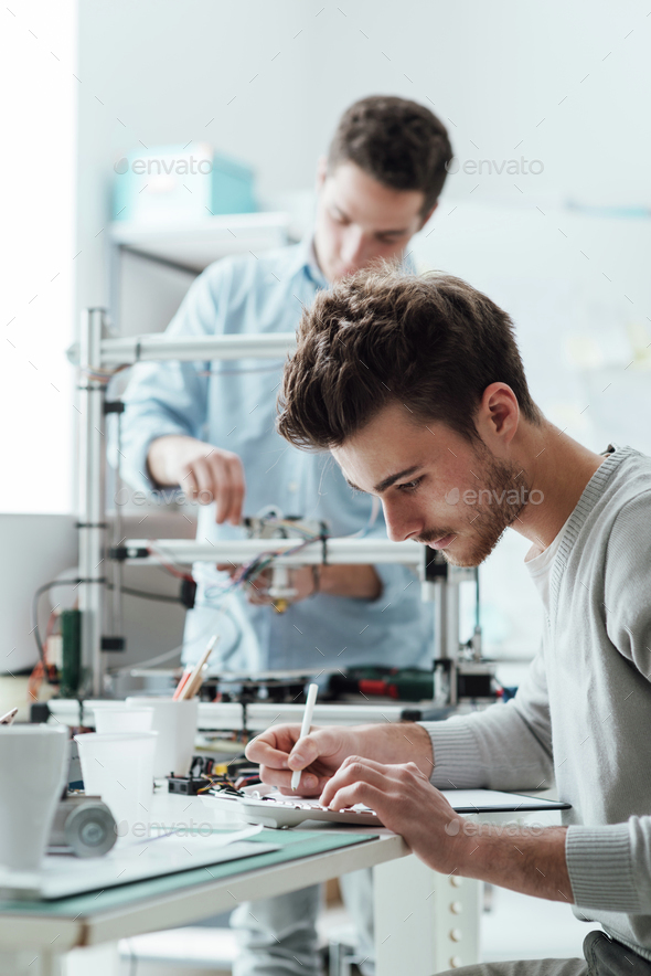 Engineering students working in the lab - Stock Photo - Images