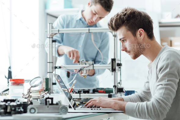 Engineering students working in the lab - Stock Photo - Images