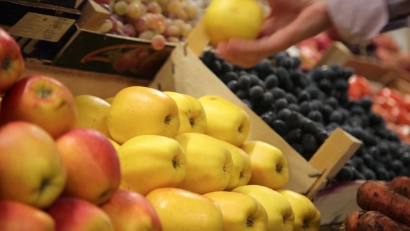Buyer Chooses The Apples On The Market And Adds To Cart alt