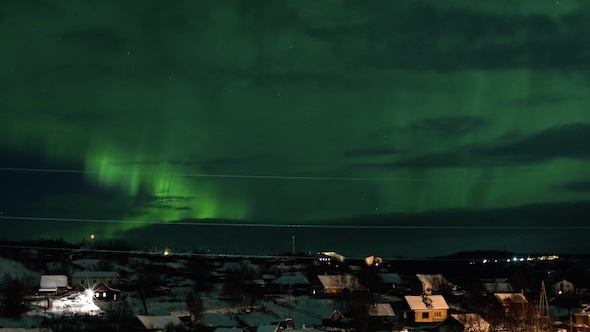 Northern Lights Above Houses