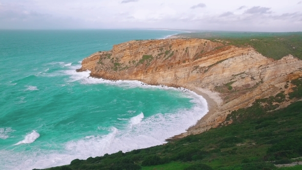 Ocean Waves Incoming On Stone Beach alt