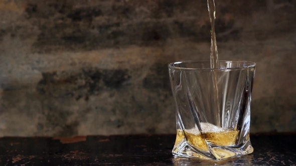 Pouring Whiskey In Glass