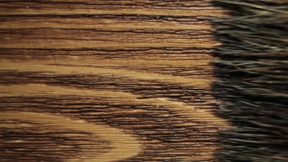 Wood Painting With a Brush With The Brown Color