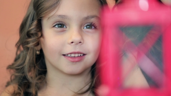 Girl Playing With Lantern, Hoping For a Miracle