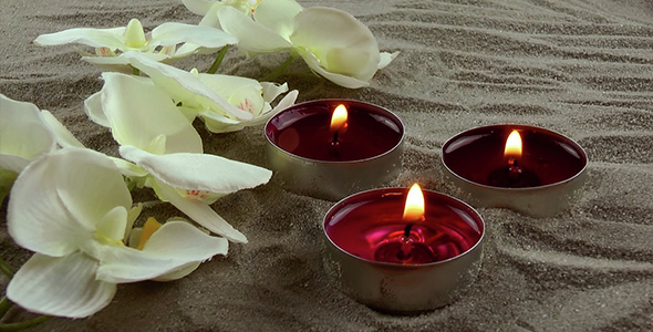 Candles & White Orchid on the Sand