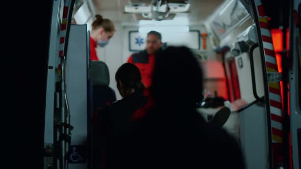 Paramedics Rescuing Patient After Car Accident alt