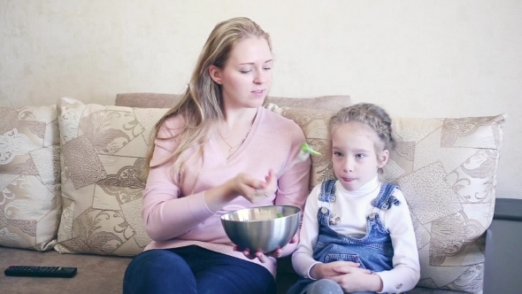 Woman With Her Daughter Eat Salad