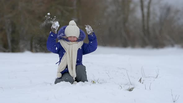 Cheerful child enjoying beautiful winter day
