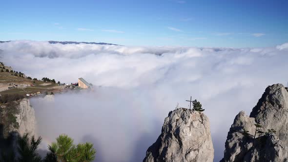 Aerial View of Thick Fog Like Beautiful Ocean of Clouds and Mountain Peaks Above Clouds alt