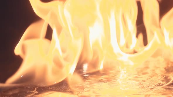 The Fire Burns With A Lot Of Sparks On Black Background In Slow Motion 3