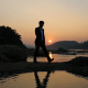 Businessman Walking at River Sunset - VideoHive Item for Sale