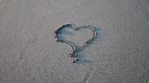 Heart Drawn On The Sand Erasing Wave