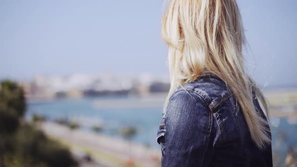 Woman Looking To The Kasbah Of The Udaya alt